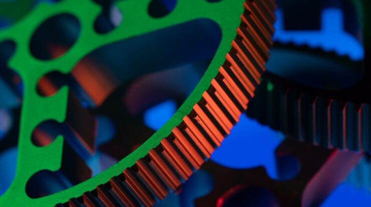 Close-up macro image of vibrant colored gears showcasing precision engineering and industrial mechanics. - Photo by Rafael Minguet Delgado on Pexels